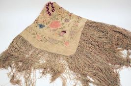 A late 19th century Chinese silk shawl: with all over designs of flowering peonies,