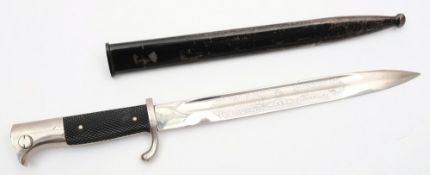 A German dress bayonet by WKC:, the single edged fullered blade with acid etched decoration,