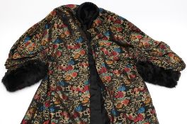 A Chinese silk housecoat,: embroidered phoenix bird decoration, to a black ground.