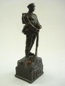 A bronzed figure of a WWI rifleman on a square plinth base inscribed 'Artists Rifles':,