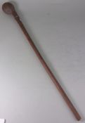 A South African knobkerrie: of traditional design with bulbous circular head and tapering shaft,