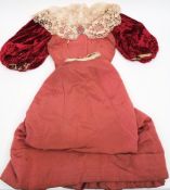 A late Victorian pink silk and lace bodice with matching skirt, the ribbed bodice with lace up back,
