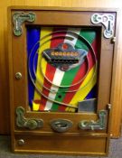 An amusement arcade wall-mounted flipper operated game: contained in an oak case,