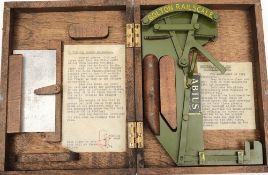 A Bolton Railscale in fitted case by Abtus:, the green enamel scale signed as per title,