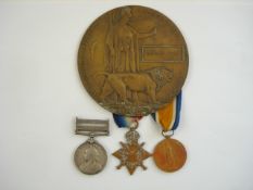 A WWI Commemorative plaque to Charles Price, together with a matched set of three service medals:,
