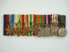 A WWII medal group of eight:, 1939-45 Star, Atlantic Star, Africa Star, Italy Star, defence Medal,