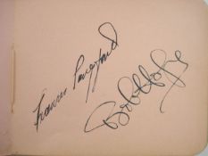 An autograph album containing various signatures including Glenn Miller, Bob Hope, Bud Flanagan,