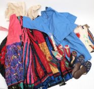 A collection of Chinese silk textiles: including skirts, jacket, cuffs, shoes and assorted panels.
