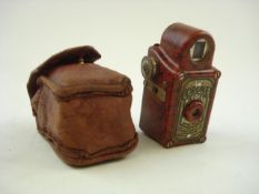 A red Bakelite Cornet Midget camera in case:..
