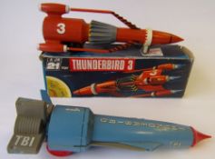 A JR 21 Thunderbird 3: in orange plastic with friction drive and black wheels,