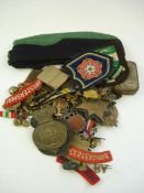 A collection of WWI and WWII cap badges, buttons and shoulder badges, :etc.