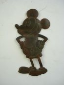 A pre war Mickey Mouse pressed brass radiator grille badge:, with 'pie-crust' eyes,