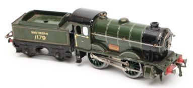 Hornby, an 0-4-0 clockwork locomotive No 1179 and four wheel tender: in Southern green livery.