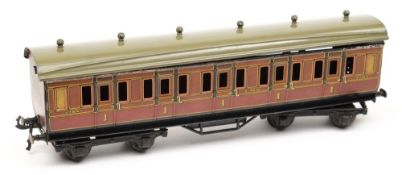 A Basset Lowke all 1st class bogie coach: in LMS maroon livery