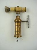A 19th century Kings pattern corkscrew:, the bone handle with brush over a rack and pinion.