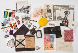 A large collection of military ephemera: including photographs, postcards, medallions,