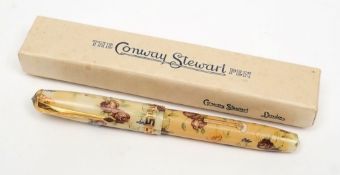 A Conway Stewart 22 fountain pen with Floral lithograph case:, 14ct gold No 5 nib,