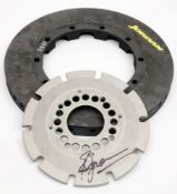 Jordan Formula One Racing Team- a carbon fibre brake disc and aluminium mounting bracket signed by