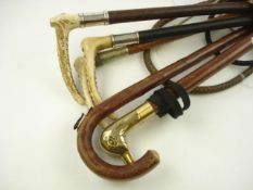 Three riding crops by Swaine & Adney:, two with silver ferrule,