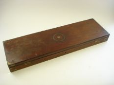 A mahogany shotgun case:, inset circular brass folding handle to top with brass mounts to corners,