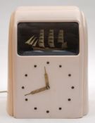 An Art Deco Vitascope pink Bakelite automaton ship clock:,
