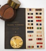 A circular brass pocket sextant by Elliott Brothers, London:,