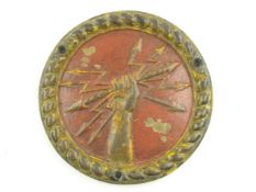 A painted bronze tompion or boat badge for the Orion-class battleship HMS Thunderer (1911-1926):,
