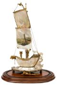 A Regency design Continental mother of pearl and gilt brass twin branch candelabrum in the form of