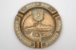 A cast bronze ashtray for HM Dockyard Simon's Town:, dated 1939-45, the centre with ship, crest,