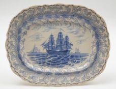 A 19th century Staffordshire blue and white meat plate with transfer decoration of a man-o-war