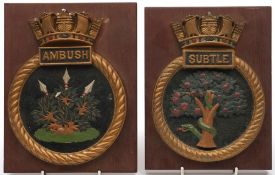 Two submarine ward room badges, HMS Subtle and HMS Ambush:, both mounted on mahogany plinths, 25.
