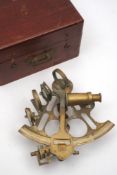 An ornamental brass 8 inch vernier sextant stamped 'Elliot Bros, London':,