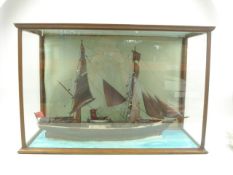 A cased model of a two masted transitional sail/steam schooner 'The Gypsy Queen' originally berthed