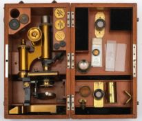 A lacquered brass monocular microscope by C Reichert Wien:, number '11015',
