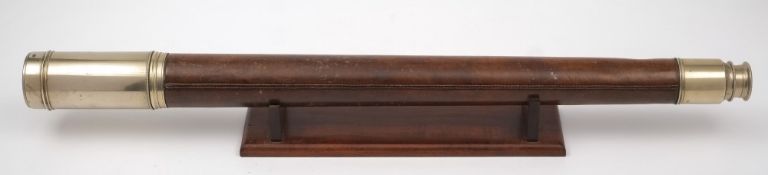 A leather cased single draw presentation telescope by Troughton & Sims, London:,