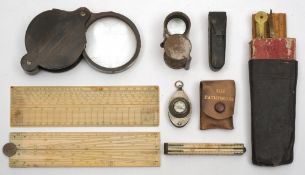 A collection of 19th century ivory rules, geometry sets, tortoiseshell and silver spy glasses, etc:.
