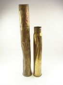 A salvaged 50 calibre shell case together with a 4 inch shell case in similar condition:,