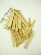 A collection of marine ivory tools and teethers:,