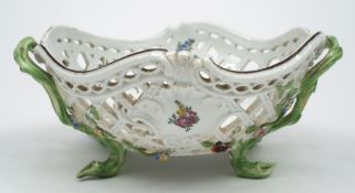 A Meissen [Marolini] pierced basket: of rococo form with branch handles and feet,