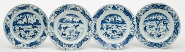 A set of four Chinese blue and white plates: each painted in the centre with The Eight Horses of Mu