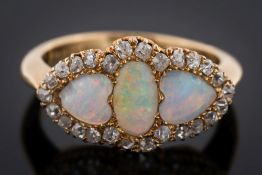 An opal and diamond cluster ring: with central oval opal between heart shaped opals,