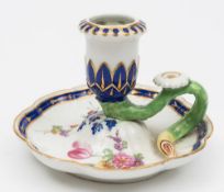 A Chelsea Derby porcelain chamberstick: with octofoil base and circular sconce moulded with stiff