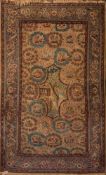 A Kashan rug:, the camel field with a central shaped medallion with building,