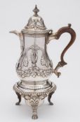 A George III silver coffee pot, all marks worn and rubbed, London, 1777: of baluster form,