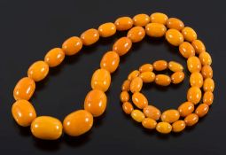 A graduated amber coloured bead,