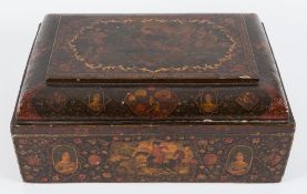 A large 19th century Qajar polychrome lacquered papier-mache casket: of rectangular form with domed