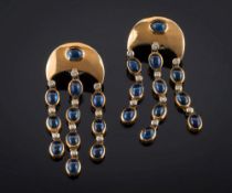 A pair of cabochon sapphire and diamond mounted chandelier drop earrings: each with three drops of