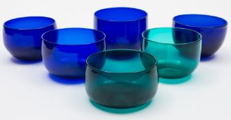 A collection of fifteen 19th century blue and green glass finger bowls: eleven in blue,