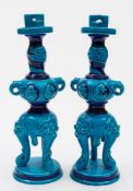 A pair of Minton majolica Japonesque candlesticks: probably after a design by Christopher Dresser