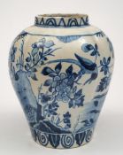 A Dutch delft jar: of lobed oviform painted in blue with a pair of geese and a magpie within a